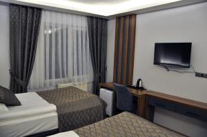Posteľ alebo postele v izbe v ubytovaní SAKA LİFE OTEL