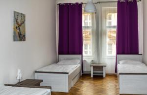 Postel nebo postele na pokoji v ubytování Welcome Hostel & Apartments Praguecentre