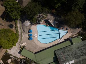an overhead view of a swimming pool in a park at Rio Escondido in San Jerónimo