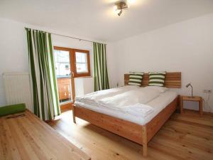 A bed or beds in a room at aeki TYROL