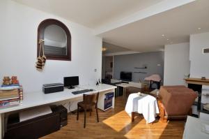 TV a/nebo společenská místnost v ubytování Apartment Gasparini