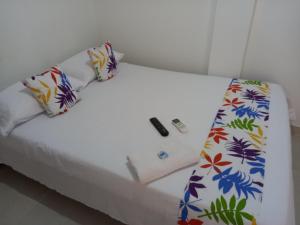 Ein Bett oder Betten in einem Zimmer der Unterkunft Hotel CHAFO