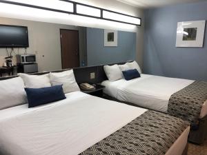 Postel nebo postele na pokoji v ubytování Microtel Inn & Suites by Wyndham Klamath Falls