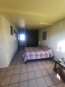a bedroom with a bed in a room at La Terraza in Ciudad Juárez