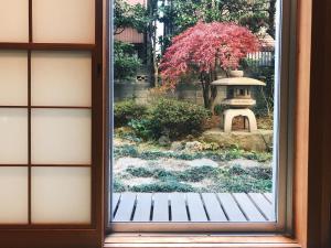 a window view of a japanese garden at PRISM COURT 綾瀬 in Tokyo