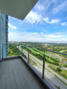 a balcony of a building with a view of a highway at Conezion Putrajaya at IOI Mall in Putrajaya