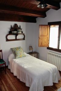 Un pat sau paturi într-o cameră la El Camino del Arcipreste