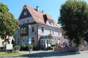 a large house with people sitting outside of it at Eichamt in Sigmaringen