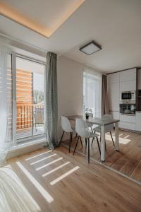 Kuchyňa alebo kuchynka v ubytovaní Apartmány u Škraba