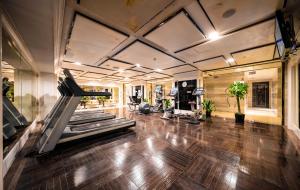 a gym with treadmills and a treadmill at Tonino Lamborghini Hotel Kunshan City Center in Kunshan