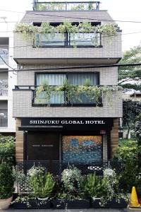 a building with potted plants on top of it at SHINJUKU GLOBAL HOTEL in Tokyo