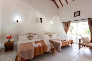 Postel nebo postele na pokoji v ubytování Villa Veuve Casadani Hotel