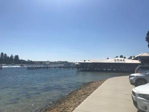 a view of a body of water with a dock at Black Swan Vista in North Fremantle