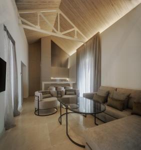 a living room with a couch and a table at Apartamentos Los Patios del Pañuelo in Córdoba