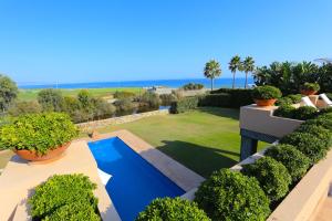 an aerial view of a garden with a swimming pool at Las Ranas CASASOLA BEACH & GOLF VILLA in Estepona