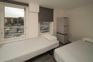 Postel nebo postele na pokoji v ubytování Harbourside Hostel Bristol