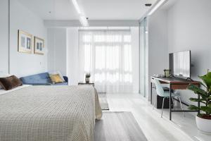 Postel nebo postele na pokoji v ubytování Satori Suites