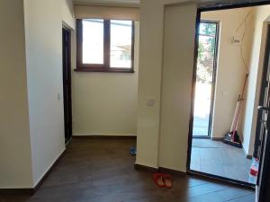 a hallway with a door leading into a room at Guest House Gelit in Mtskheta