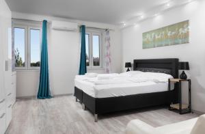 Posteľ alebo postele v izbe v ubytovaní Imperial Apartments Schönbrunn - Contactless Check-In