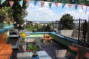 a patio with a picnic table and a pool at Johnston House: Historic Village Retreat in Kinvara