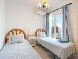 A bed or beds in a room at 2 Mijas Playa Club in La Cala de Mijas