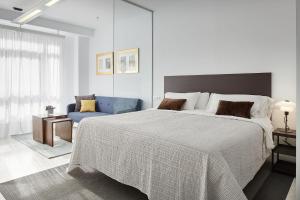 Postel nebo postele na pokoji v ubytování Satori Suites