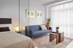 Postel nebo postele na pokoji v ubytování Satori Suites