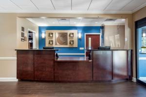 a lobby with a reception desk in a office at Comfort Inn & Suites in Fort Walton Beach