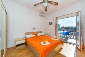 Postel nebo postele na pokoji v ubytování Apartments Ostrog