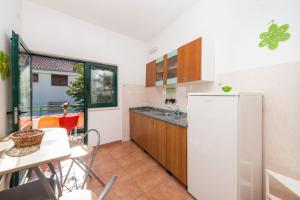 Kuchyň nebo kuchyňský kout v ubytování Apartments Ostrog
