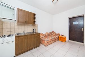 Kuchyň nebo kuchyňský kout v ubytování Apartments Ostrog