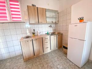 Kuchyň nebo kuchyňský kout v ubytování Apartments Ostrog