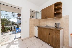 Kuchyň nebo kuchyňský kout v ubytování Apartments Ostrog
