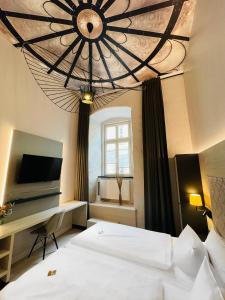 Giường trong phòng chung tại Design-Apartments Am Kaisersaal