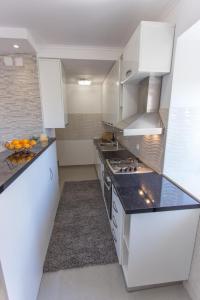 Kuchyňa alebo kuchynka v ubytovaní Apartment Mojaš