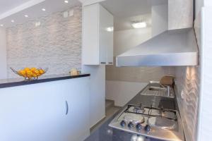 Kuchyňa alebo kuchynka v ubytovaní Apartment Mojaš