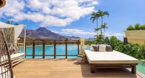 a patio with a bed and a view of the mountains at Royal River, Luxury Hotel - Adults Only in Adeje