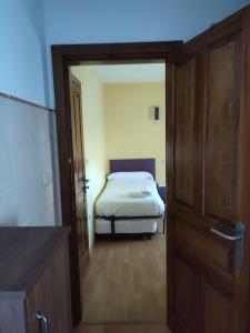 Postel nebo postele na pokoji v ubytování Albergue rural l'Almada de Yebra