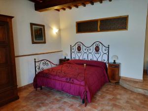 A bed or beds in a room at SassoMatto b&b BioAgrituRelax