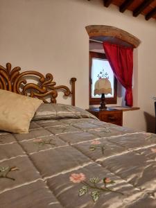 Posteľ alebo postele v izbe v ubytovaní SassoMatto b&b BioAgrituRelax