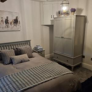 Postel nebo postele na pokoji v ubytování Denver Cottage