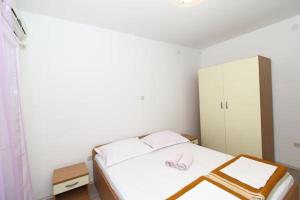Ein Bett oder Betten in einem Zimmer der Unterkunft Apartmani Joško Duće - Omiš