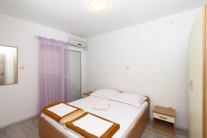Ein Bett oder Betten in einem Zimmer der Unterkunft Apartmani Joško Duće - Omiš