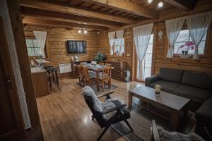 a living room with a couch and a table at Chata Vŕšky Terchová in Terchová