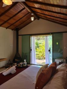 Cama ou camas em um quarto em Pousada Maritacas do Sana