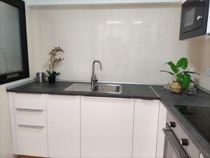 A kitchen or kitchenette at CITY&SEA