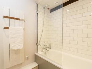 a bathroom with a tub and a glass shower at The Old Swill House in Chippenham +21 photos
