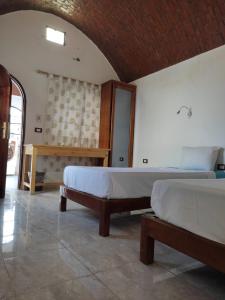 A bed or beds in a room at Nubian Holiday House Aswan