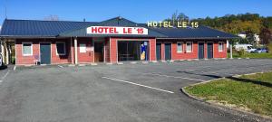 a hotel lee in a parking lot at Hôtel Le 15 in Coulounieix-Chamiers