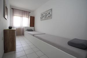 Postel nebo postele na pokoji v ubytování Apartments Zeljko
